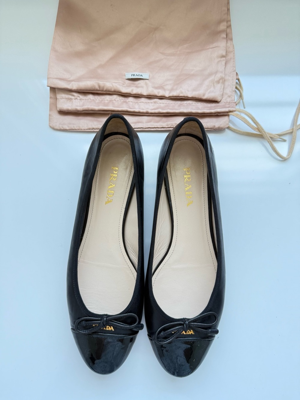 Prada Black Leather Ballet Flats with Patent Cap Toe and Bow - Picture 1 of 5